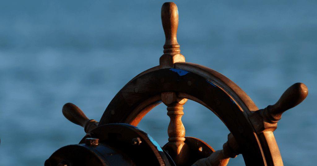 an image of a ship steering wheel